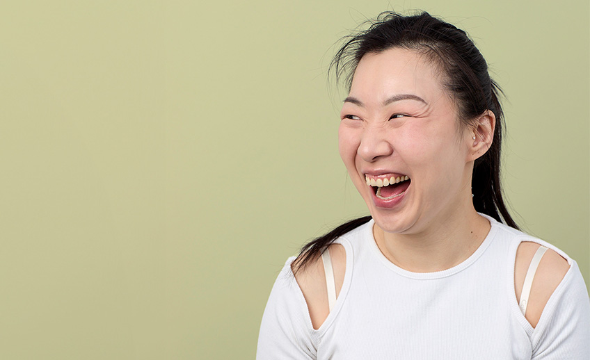 An image of a young woman laughing